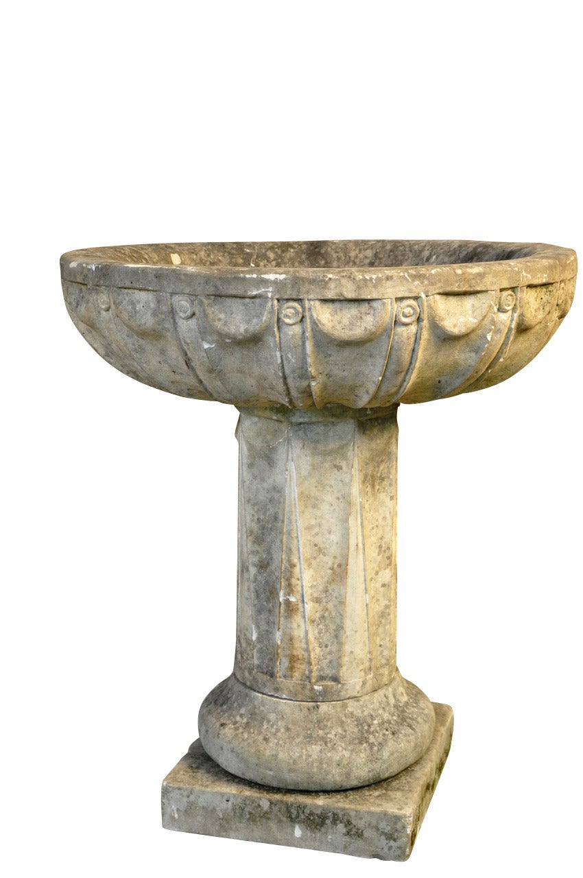 A very striking 19th century baptismal font carved from limestone.  The font is in three sections.  This font would serve as a wonderful bird bath as well.
