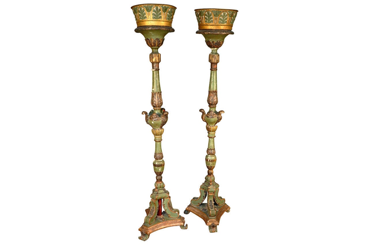 A truly exquisite pair of 18th century Northern Italian torchère in painted and giltwood. The shades are pierced metal and polychromed. They are lined in a white silk.