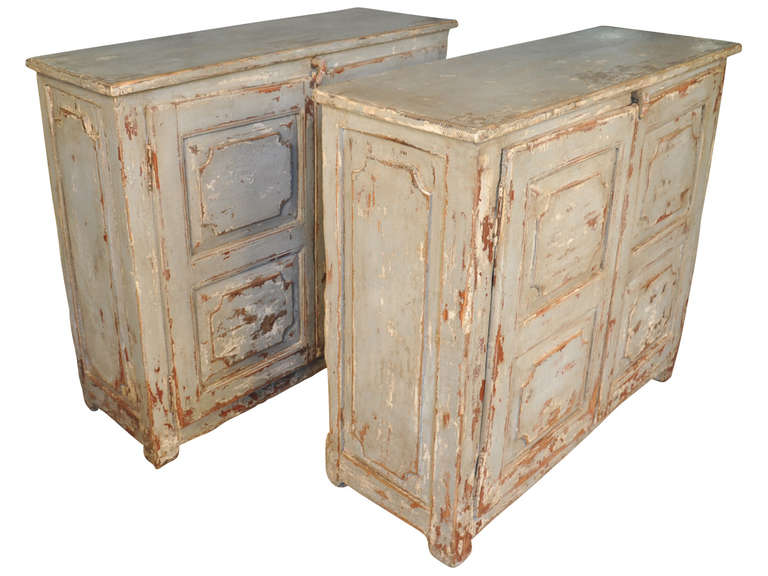 A charming pair of early 19th century painted Portuguese buffet.  The double doors open to expose one interior shelf.  The coloration is in the light shades of blue.  Not only is the pair delightful buffets, but would serve wonderfully as consoles