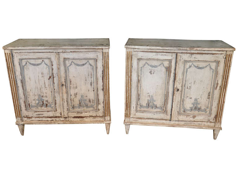 A charming pair of early 19th century painted buffets from the Catalan region of Spain in the Louis XVI taste.  Circa 1830.  These wonderful buffets can serve as wonderful consoles, sideboards, or even as higher end tables. The price for the pair is