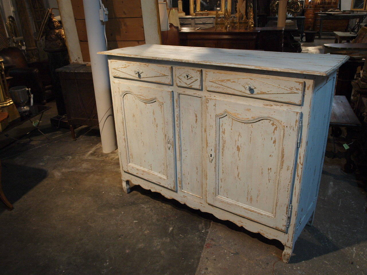 French early 19th century Provencal buffet in painted wood.  The minimalist lines of this pieces - along with the very refreshing finish in very pale powdery blue - make this piece so inviting.  It is a wonderful storage piece with three drawers and