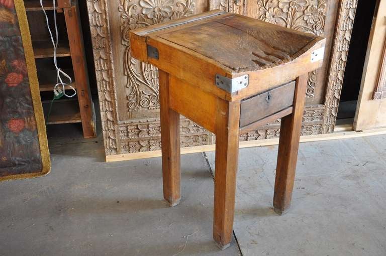 Charming,diminutive and very well loved 19th century French maple butcher block table. The piece is in two sections with the butcher block fitting to the base. It has one drawer, a semi-circular knife and knife sharpener.

Keywords: kitchen table,