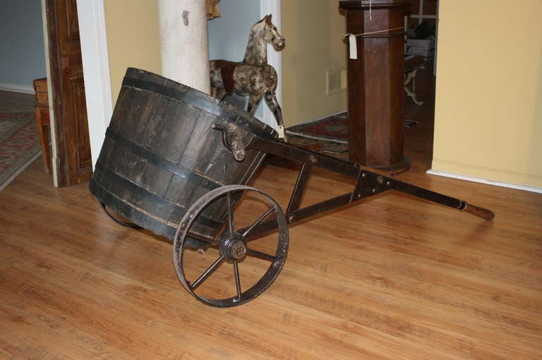 Late 19th century French antique grape harvesting basket with iron cart. This is a great piece for the wine enthusiast. It would be a lovely decoration in a wine cellar or used as a display  in a wine store or restaurant.