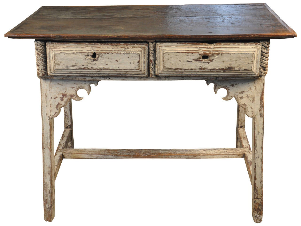 A terrific Farm House Table - Work Table in painted wood from the Catalan region of Spain.  This early piece - early 18th century - has a solid board top and two drawers.  It's height makes this an excellent work table or kitchen island.