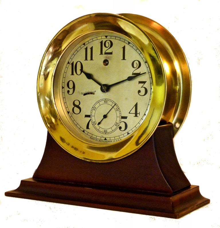 Stand included, a $75.00 value!

A classic ship's Wardroom clock which keeps excellent time, and is in outstanding condition all around!

Presented is a Seth Thomas ship's clock from the 1920's, that was mounted on a bulkhead, on a ship's