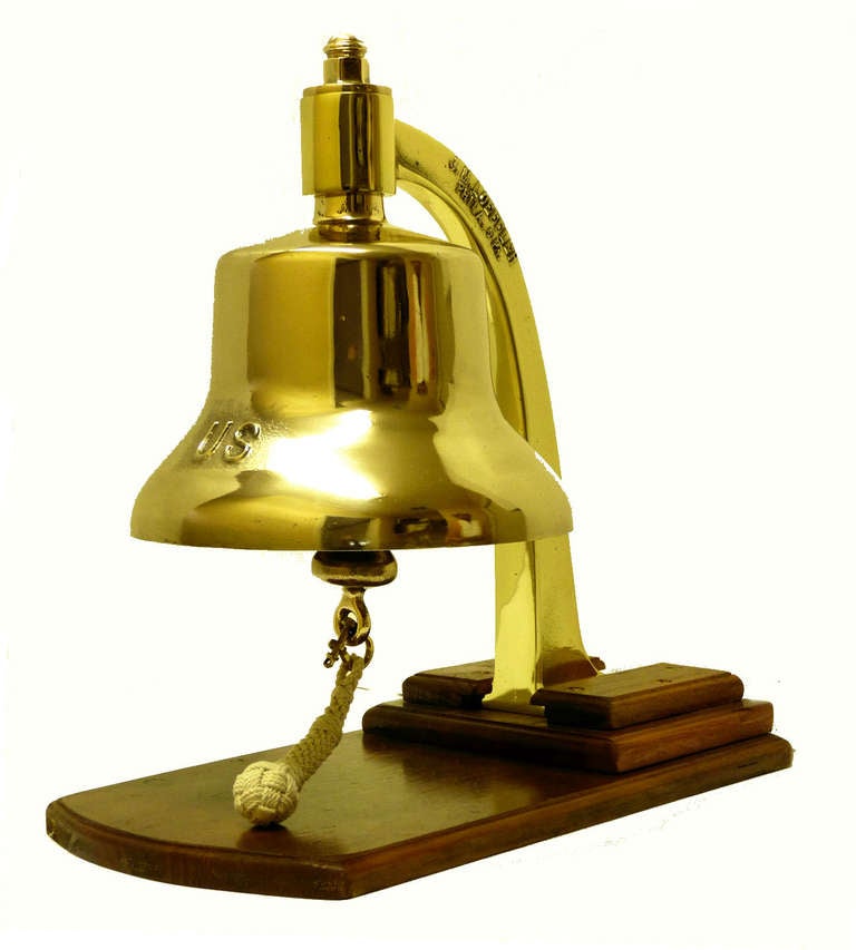 Presented is a post WW II military bell that is mounted to a classic WW II inverted 