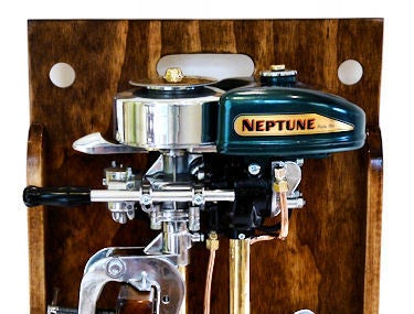 Presented is a stunning display using an actual resurrected 1939 outboard motor that had its external parts reconditioned, re-chromed and polished, and then mounted on a carrying panel with accompanying starter cord, spare prop and two cans of
