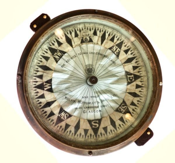 A very important and rare English dry card compass made by Kelvin, Bottomley & Baird is presented as a display. It is based on a design of a light weight dry compass card invented by Sir William Thomson, later Lord Kelvin of Largs. The huge compass