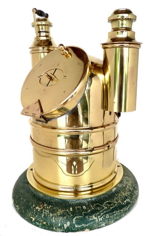 Modified to preserve the top section only, this table top display binnacle makes a dramatic statement of importance. It is a perfect gift or serves as a focal point in any decor.

The partially gimbaled compass has a 6 inch Ritchie card made from