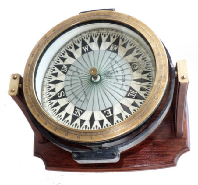 Here is a very important English dry card compass made by Kelvin, Bottomley & Bard. It is based on a design of a light weight dry compass card invented by Sir William Thomson, later Lord Kelvin of Largs. The threaded compass were originally made