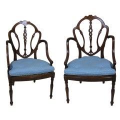 Pair of British Colonial arm chairs