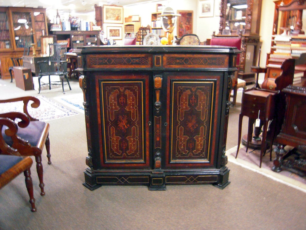 American Renaissance Revival cabinet, New York, Herter Brothers.<br />
A fine example of Herter Bros work, featuring stellar, intricately inlaid veneers