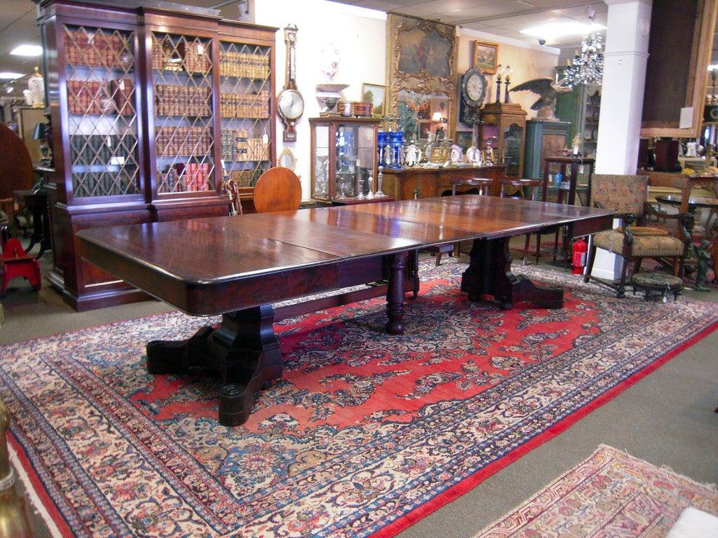 Impressive American Empire banquet table, mahogany with six leaves, storage box for leaves tucks below. This table, with Southern provenance, is the classic 'groaning board.' Simply lovely!