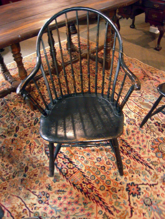 Associated set of 11 painted Philadelphia bow- backed Windsor chairs by John B. Ackley, a well-known maker active in the trade until 1830.  The incredible form and workmanship of this set is highlighted by solid plank seats and with bottom