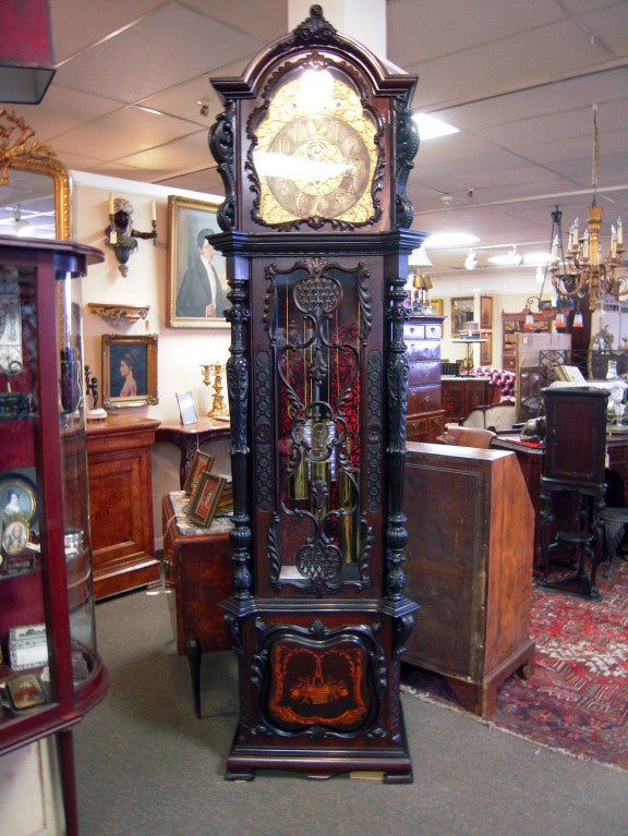 Bell Chime clock made by J. J. Elliott of London, England. Clock is in a 96 inch Mahogany Longcase with extraordinary wood work in the Chippendale style. Elliott was one of the premier English clock makers of the late 19th Century. This piece