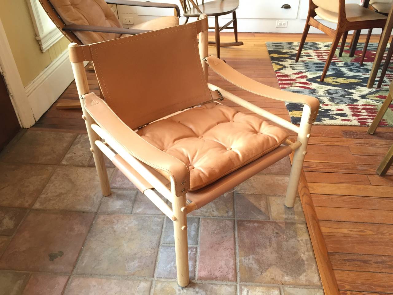 Beautiful tan leather safari chair by Swedish designer Arne Norell.