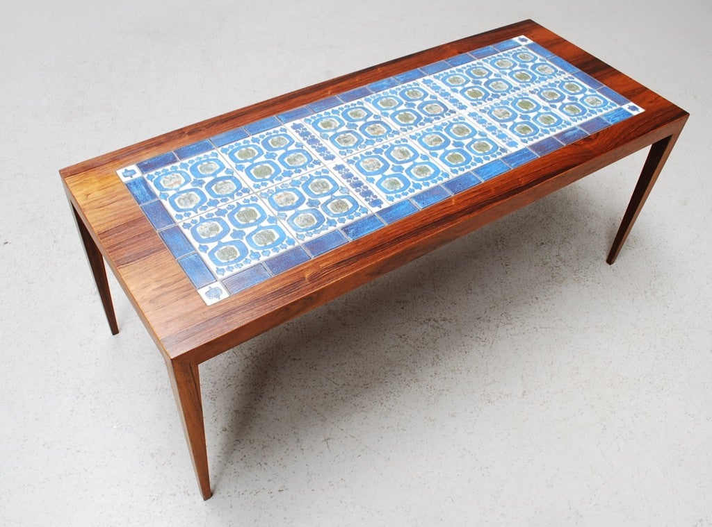 A gorgeous  rosewood coffee table with beautiful tiles. The table is designed by Severin Hansen Jr. for Haslev Møbelsnedkeri. His hallmark corner joinery is what makes this piece stand out. Ultra minimalistic, its form is simple and classic