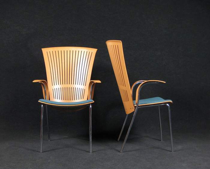 Designed by Nanna Ditzel, this set of 6 Tuba chairs is typical of her design aesthetic. These high-back dining/conference chairs with arm rest were manufactured in the early 90's in limited quantities.  They are no longer in production. The high