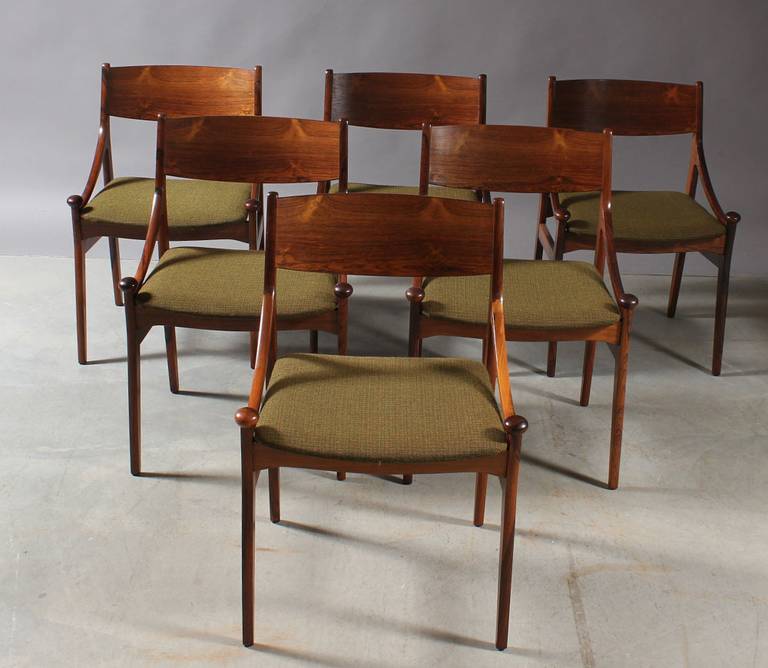 Gorgeous set of rare Mid-Century Modern rosewood dining chairs by Vestervig Eriksen. The seldom scene and unique design is highlighted by the knob that sits atop each front leg. The frames are impeccably crafted of Brazilian Rosewood, which has a