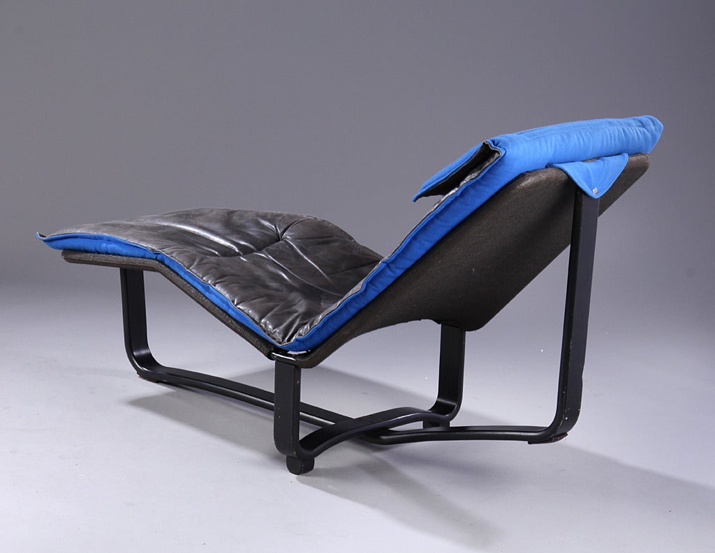 Architecturally interesting lounge chair designed by Igmar Relling (1914-2007, Norwegian), & Knut Relling (1950- (son), Norewegian. Manufactured by Westnofa. Frame of black painted ash. Upolstered 100% wool on one side and black leather on the other
