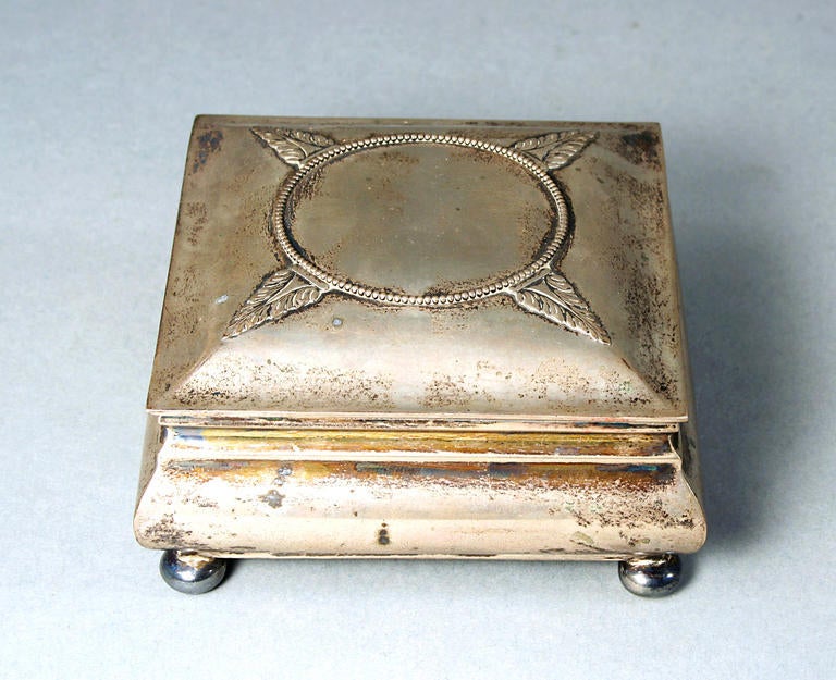 Beautiful Danish designed silver box by Christian F. Heise. The box has gilded shaped feet and an ornamnet on the lid