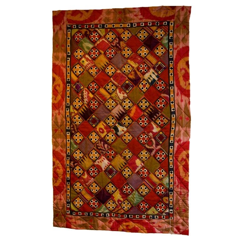 Beautiful hand embroidered Uzbekistani cotton and silk Ikat wall hanging or bed throw. This piece of art is about 80-90 years old and was probably used as a wedding dowry