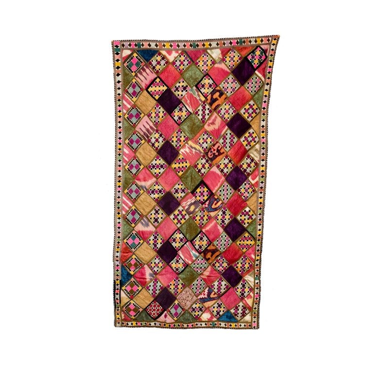 Beautiful hand embroidered Uzbekistani velvet and silk Ikat wall hanging or bed throw. This piece of art is about 80-90 years old and was probably used as a wedding dowry.
