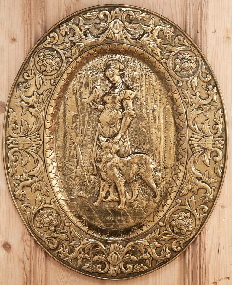 Embossed in solid brass to depict an elegant lady of the manoir in her role as hostess and in an hour of leisure with the family pet, this pair of decorative plates deserve a place of prominence in your home!