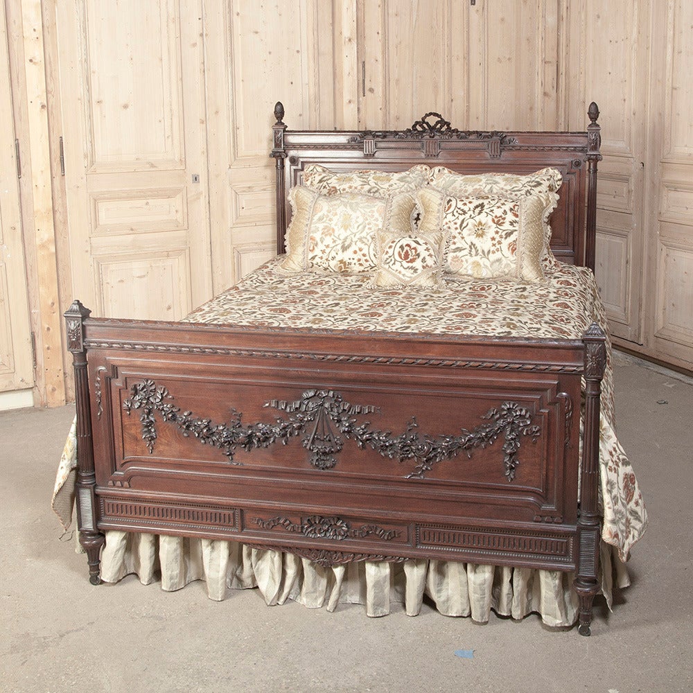 One of the premier furniture makers of France, if not worldwide, was Bellanger of Paris. This antique Louis XVI bed was handcrafted by master artisans in the style of Louis XVI using the finest imported mahogany. Carved to perfection with classical