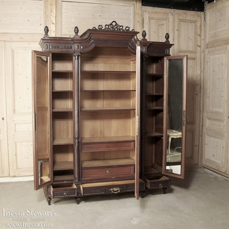 One of the premier furniture makers of France, if not worldwide, was Bellanger of Paris. This antique Louis XVI armoire was handcrafted by master artisans in the style of Louis XVI using the finest imported mahogany. Carved to perfection with