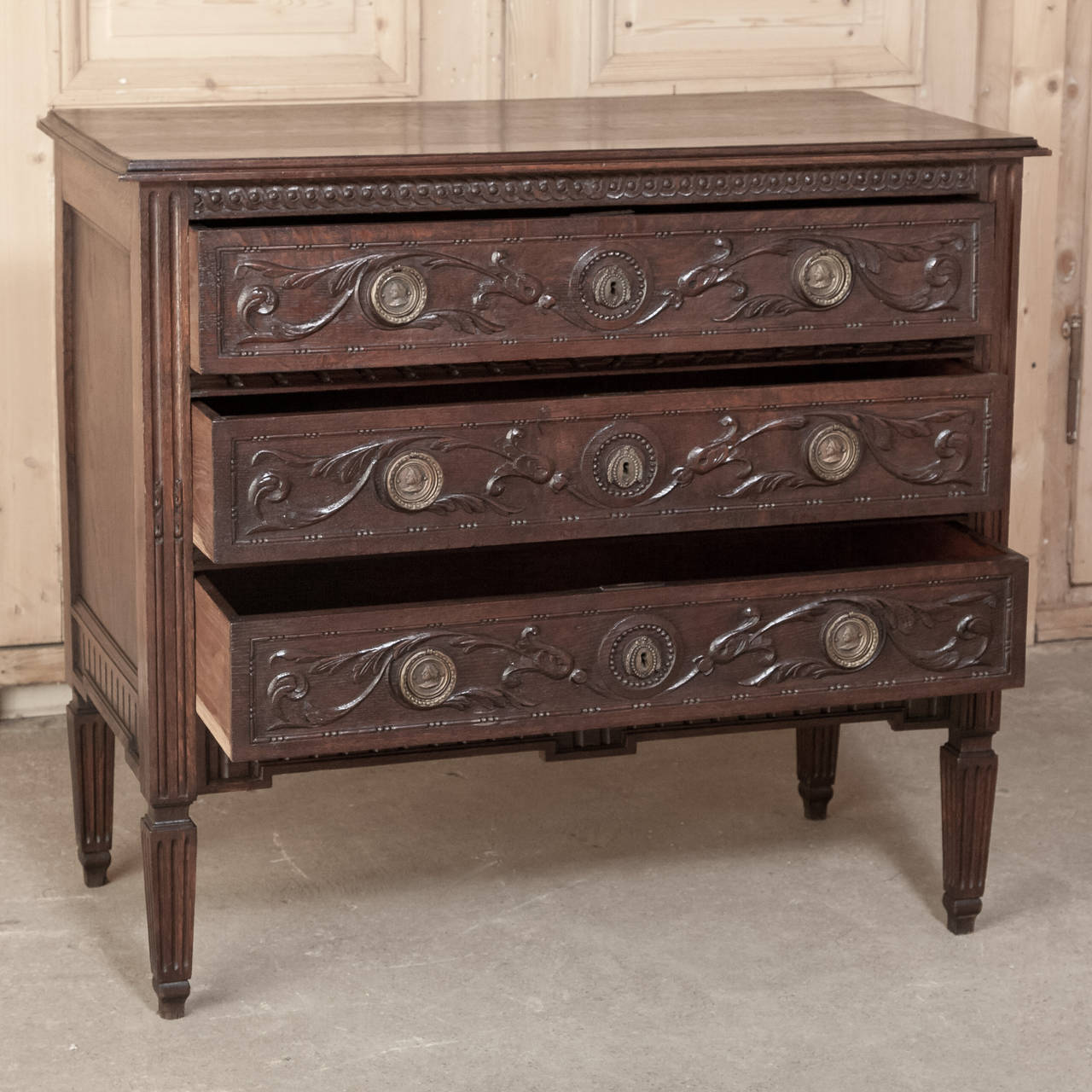 This country French commode was carved in the style of Louis XVI from solid old-growth oak and features its original cast brass pulls and keyguards!
Measures 36 H x 39.5 W x 19.5 D.
circa 1870.