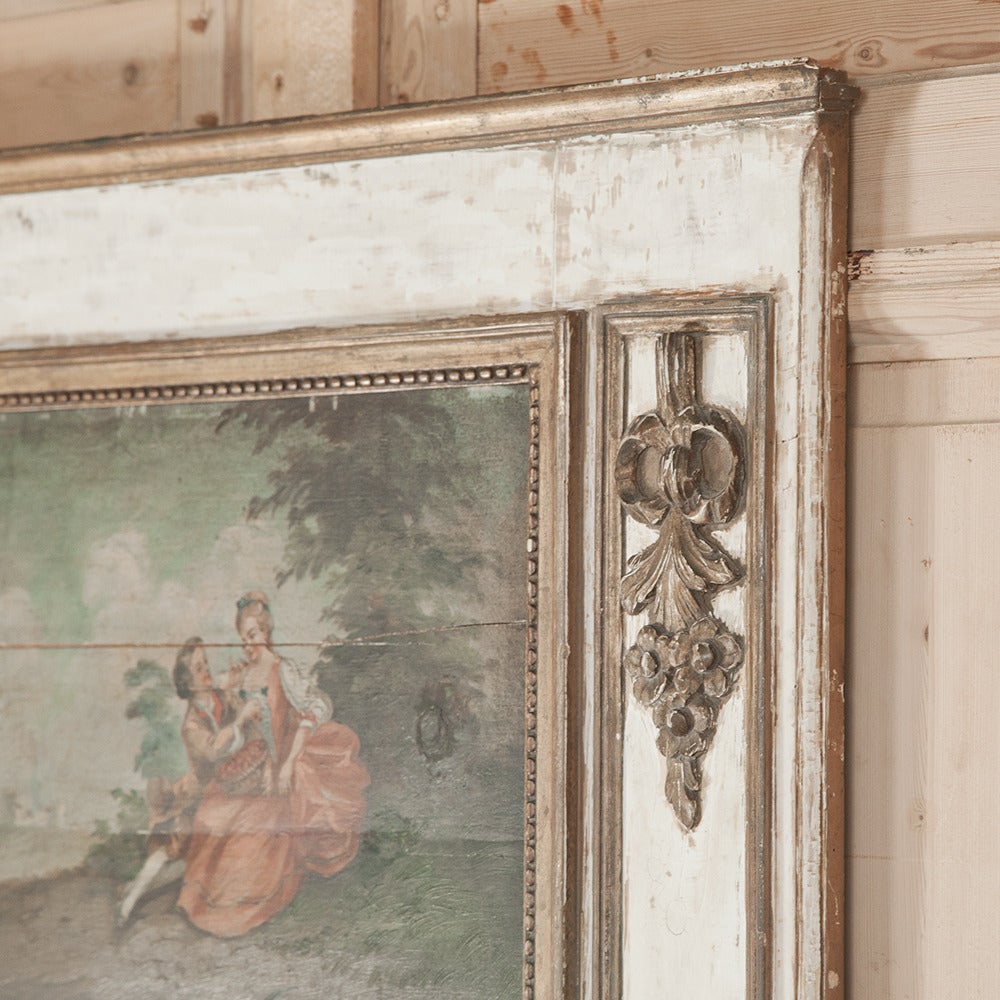 Featuring a romantic courtship scene rendered by hand in 19th century in oil on board at top, and a mirror below, this antique neoclassical French Louis XVI inspired trumeau is perfect for adding an old world touch to any room. Trumeau Mirrors in