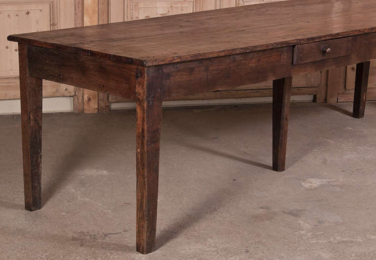 Stretching over nine feet in length, this sturdy table was designed by rural artisans from solid old-growth French white oak, and made to last for generation after generation of daily use. Note the hand-fitted joinery viewable in the detail photos.