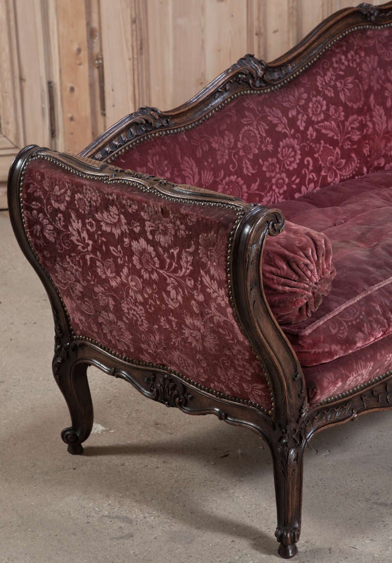 Called a grande meridienne by the French, this canape features an asymmetrical appearance perfect for lounging in luxurious comfort. Brocade upholstery is in excellent condition, and perfectly complements the artistic sculpture of the framework that