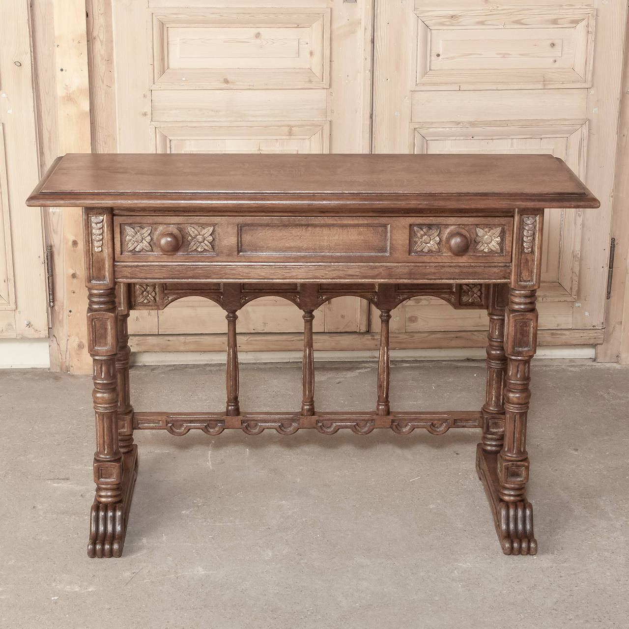 This Rustic Writing/Sofa Table is shallow enough to work behind the sofa, in a hallway, or that special niche!  Clever architecture and a couple of drawers make it visually appealing as well as functional!
Measures 32H x 46.5W x 16D
Circa 1920s