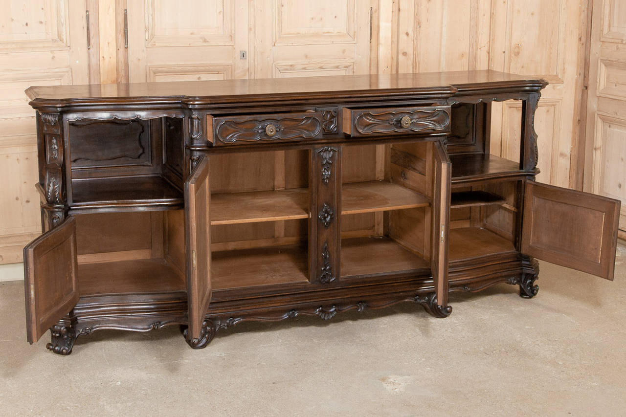 This Grand Italian Piemonte Region Walnut Buffet is a product of the master craftsmen of Northern Italy!  Crafted from solid planks of walnut harvested from the foothills of the Alps, this Italian grand table features timeless Italian styling, with