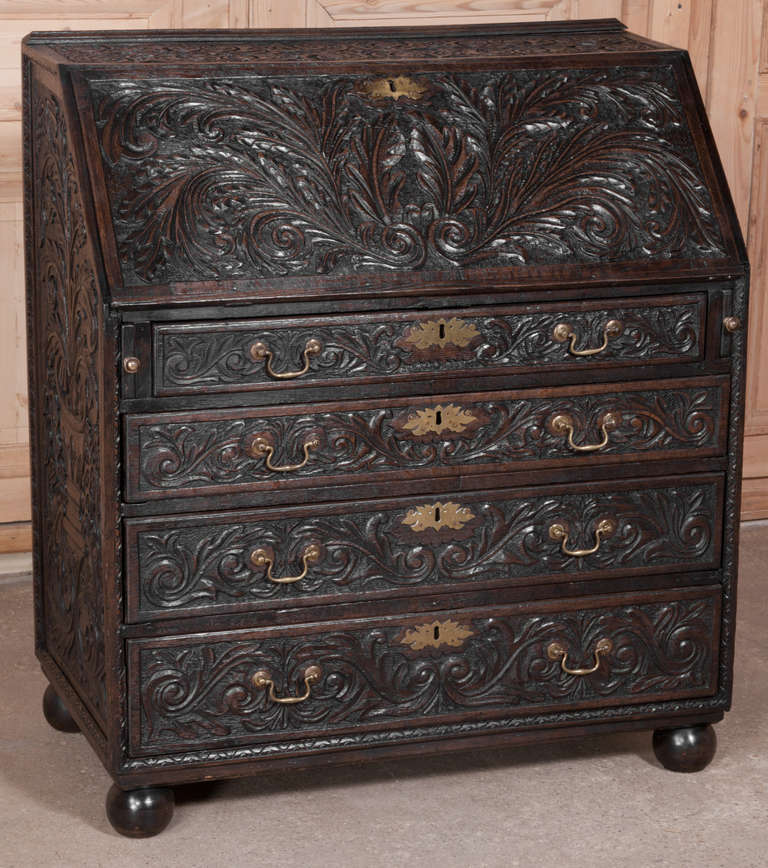 This Antique Rustic English Country Secretary was carved all over ~ even on the sides ~ from solid oak and features its original brass hardware!  The detail is astounding, even when you open up the desk to reveal the cubby drawers and cabinet. 