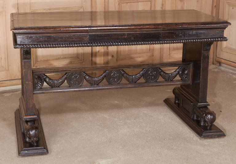 Antique English Desk features classical styling and unique elephant feet! 
Circa 1860s. 
Measures 32.5H x 58W x 32D