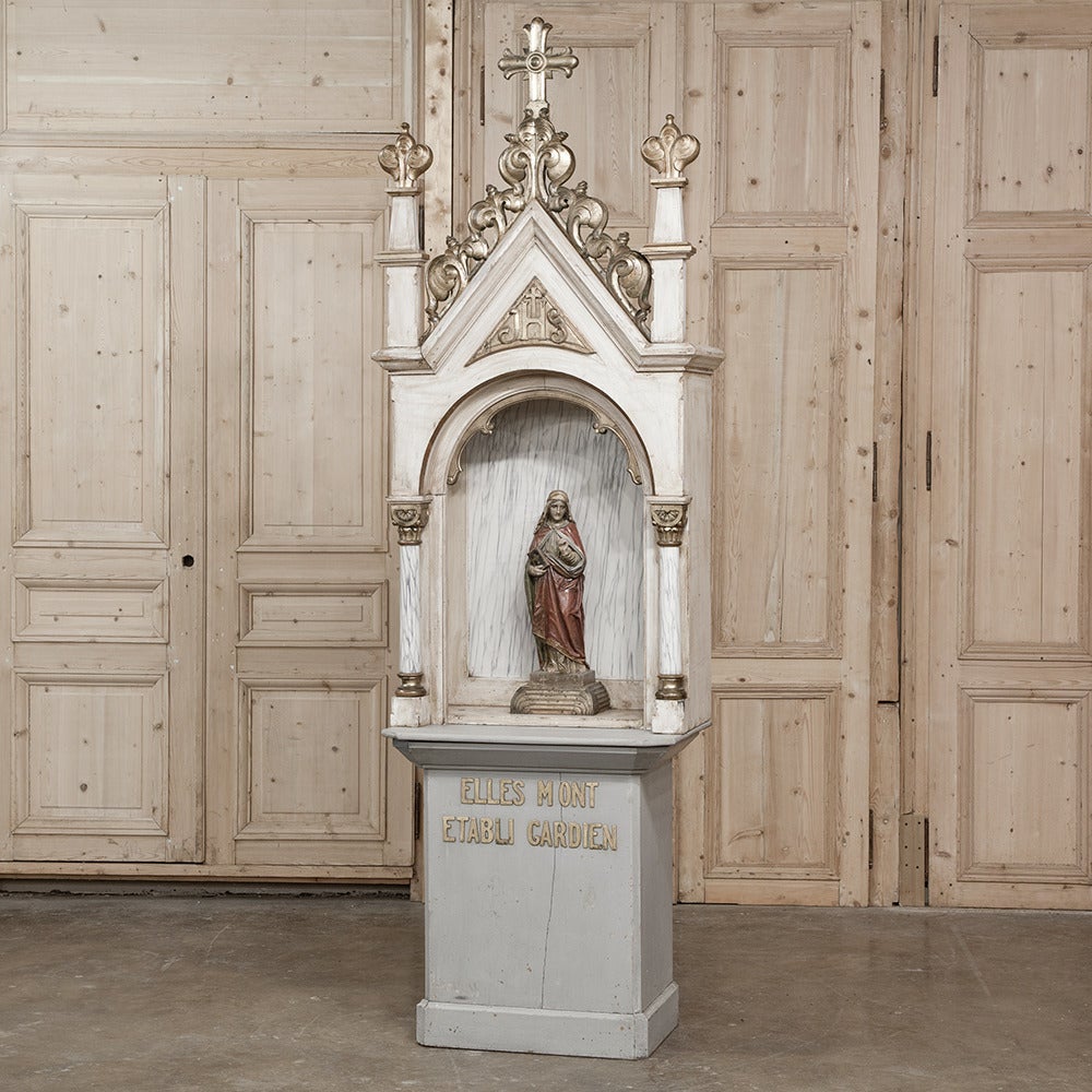 This antique Catholic shrine was placed to honor those who founded the Church at Mount Gardien, and was designed to house religious statuary. Found with its original pediment, it was designed in the Classic Gothic style and features its original