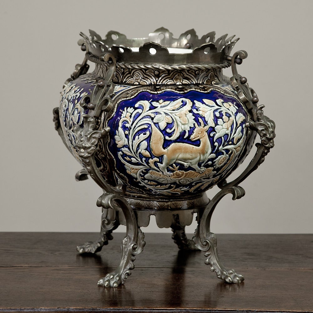 Made in France to mimic the popular oriental porcelain that was all the rage in Europe, this 19th century bronze and barbotine jardiniere features vibrant colors and bronze perfectly fitted to the contours of the piece, all done by hand, of