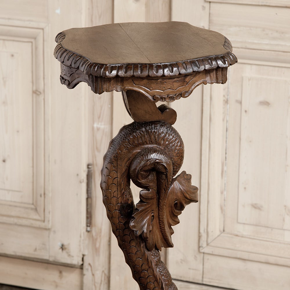 19th century Italian Renaissance carved dolphin pedestal is a superlative example of master artisanry, plus a fantastic way to display your Fine vase, statuary or objet d'art! Hand-carved from solid walnut, the expressiveness of the dragon plus the