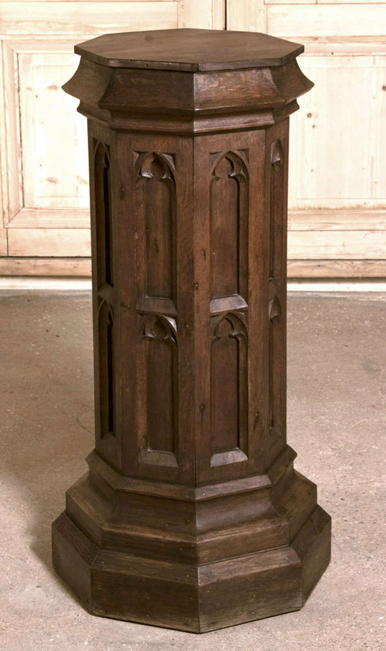 Antique French Gothic pedestal was rendered over a hundred years ago in solid white oak in the timeless Gothic style. 
Circa 1860s. 
Measures 39.5H x 19.5W x 19.5D; top is 14.5W x 14.5D.