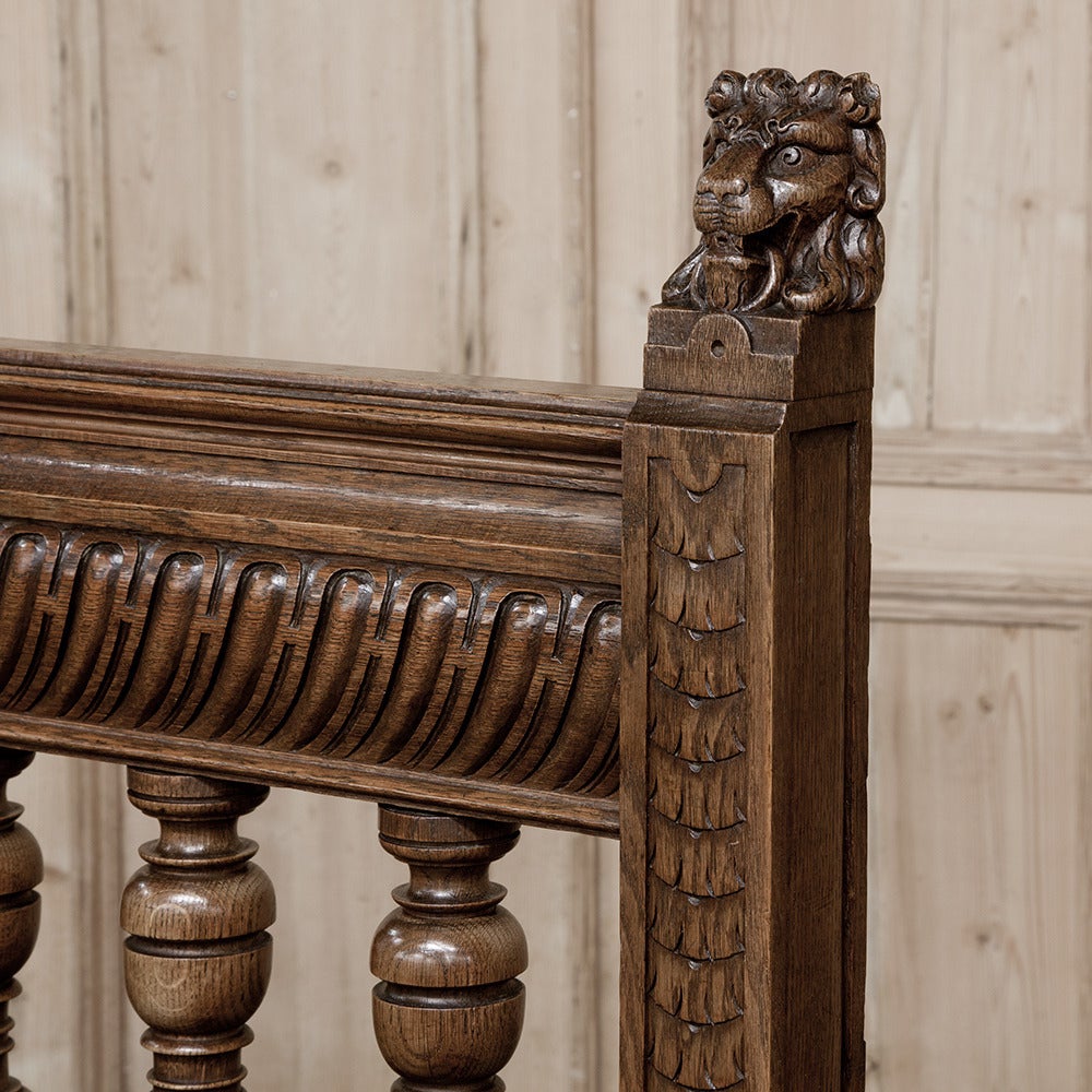 This stunning Grand 19th Century Renaissance Hall Bench features its original Aubusson Style Tapestry seat cushion for a spectacular Old World look!  Carved lions atop the seatback posts lead the eye down to the classically-inspired architecture