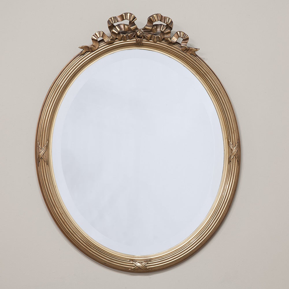 French Pair of 19th Century Neoclassical Gilded Oval Mirrors