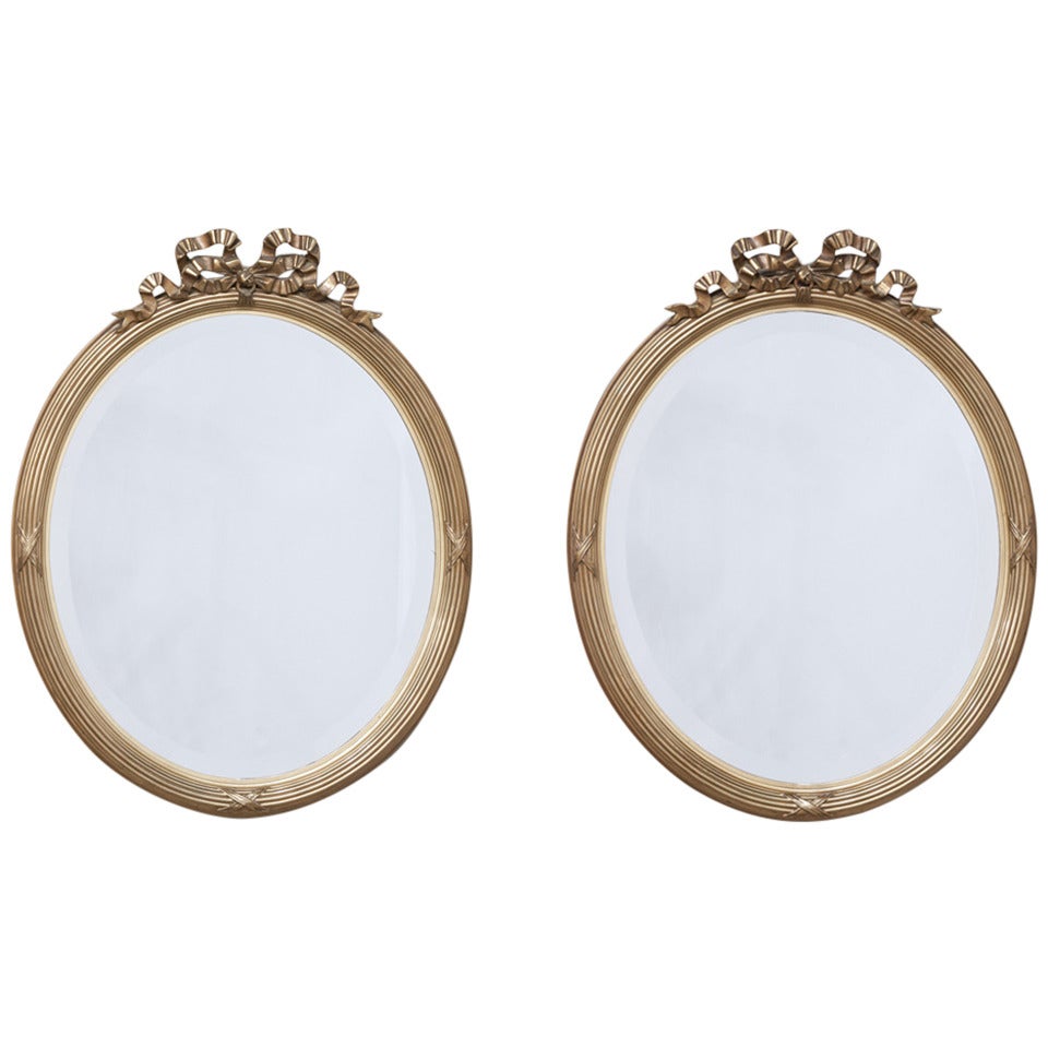 Pair of 19th Century Neoclassical Gilded Oval Mirrors