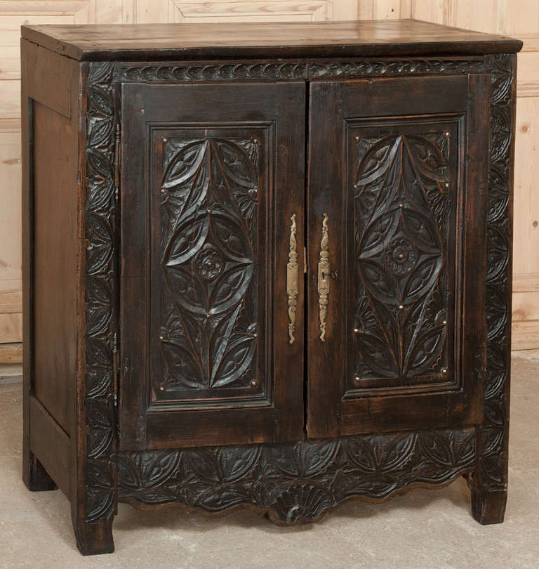 Utilizing solid planks of old-growth oak, the artisans who crafted this Gothic Buffet meant for it to last for generations!  Crafted during one of many Gothic Revivals, this one during the 18th century, it has been lavished with intricate geometric