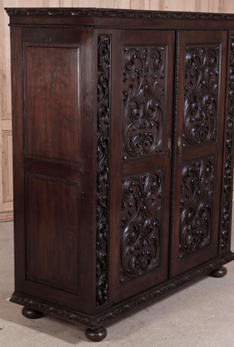 Sculpted by talented artisans from Sycamore Maple that has been stained to give the appearance of the more exotic imported mahogany, this armoire features two large doors that open to reveal a spacious interior, perfect for an entertainment center