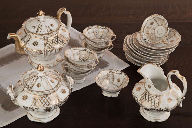 Featuring a wonderfully Baroque styling and enhancement with hand painted gold accent, this antique Vieux Paris tea set will make the ceremony of Afternoon Tea even more enjoyable for you and your guests! The tea set is in perfect condition.