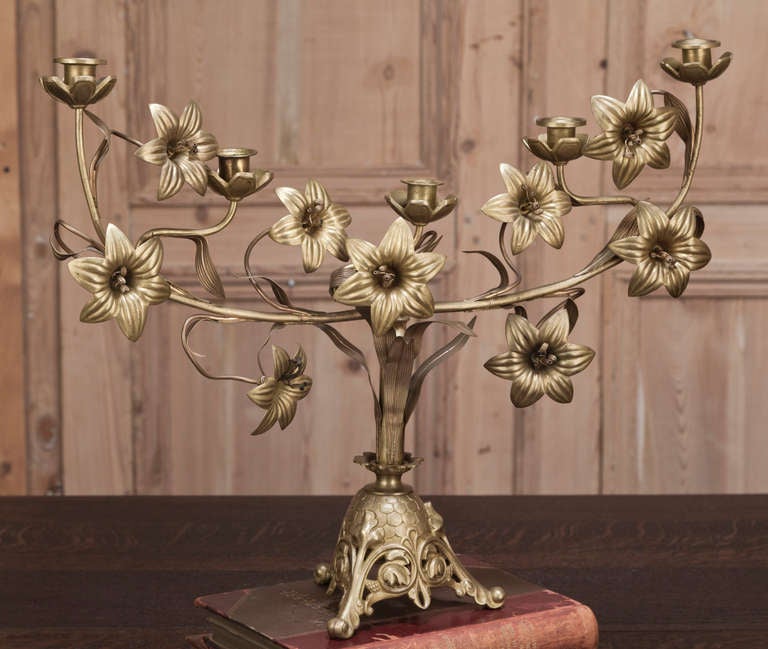 Beautiful pair of 19th Century Antique Bronze and Brass Dore Candelabra was cast to an exceptional degree of realism to depict lilies, a floral symbol of Jesus, this pair of candelabra were designed for a private chapel and represent an example of