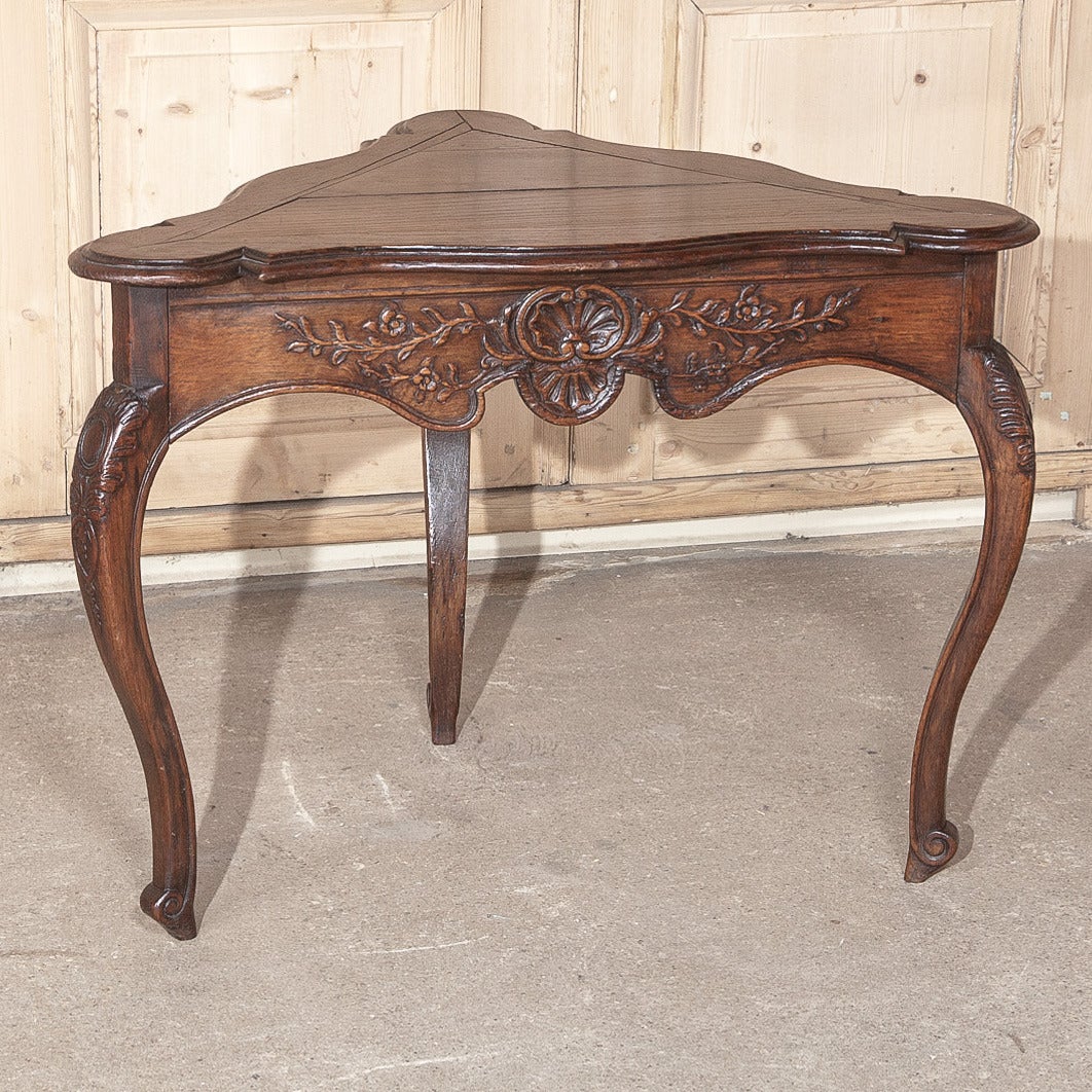 Lovingly hand-crafted from indigenous French old-growth white oak, this exceptional Country French Triangular End Table is not an equilateral triangle, but rather a right triangle with a longer hypotenuse.  Finished and carved on all sides, it is